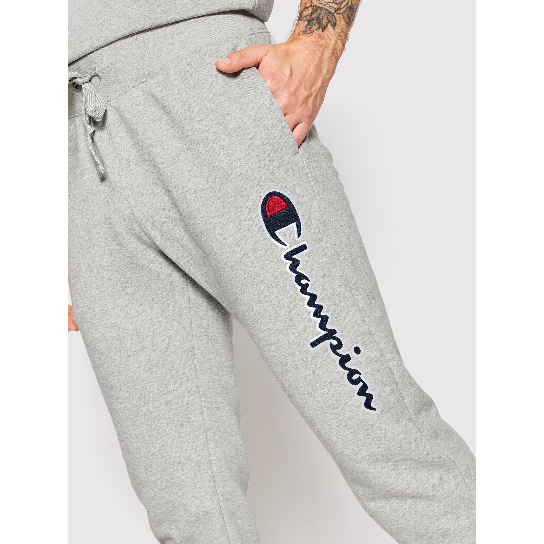 Champion Spodnji del trenirke Vertical Logo 217062 Siva Regular Fit - Pepit.si