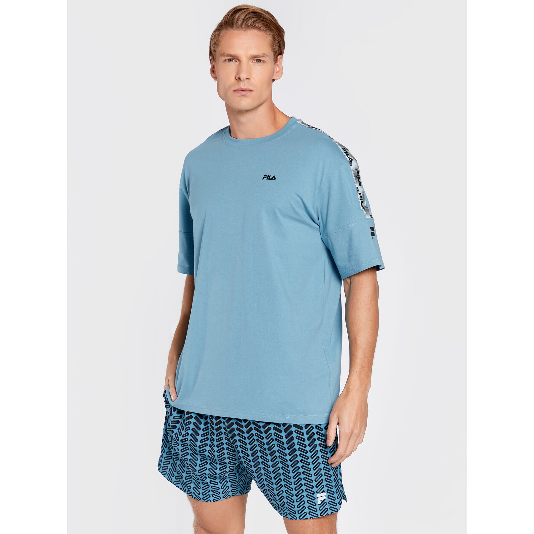 Fila Majica Brittnau FAM0194 Modra Relaxed Fit - Pepit.si