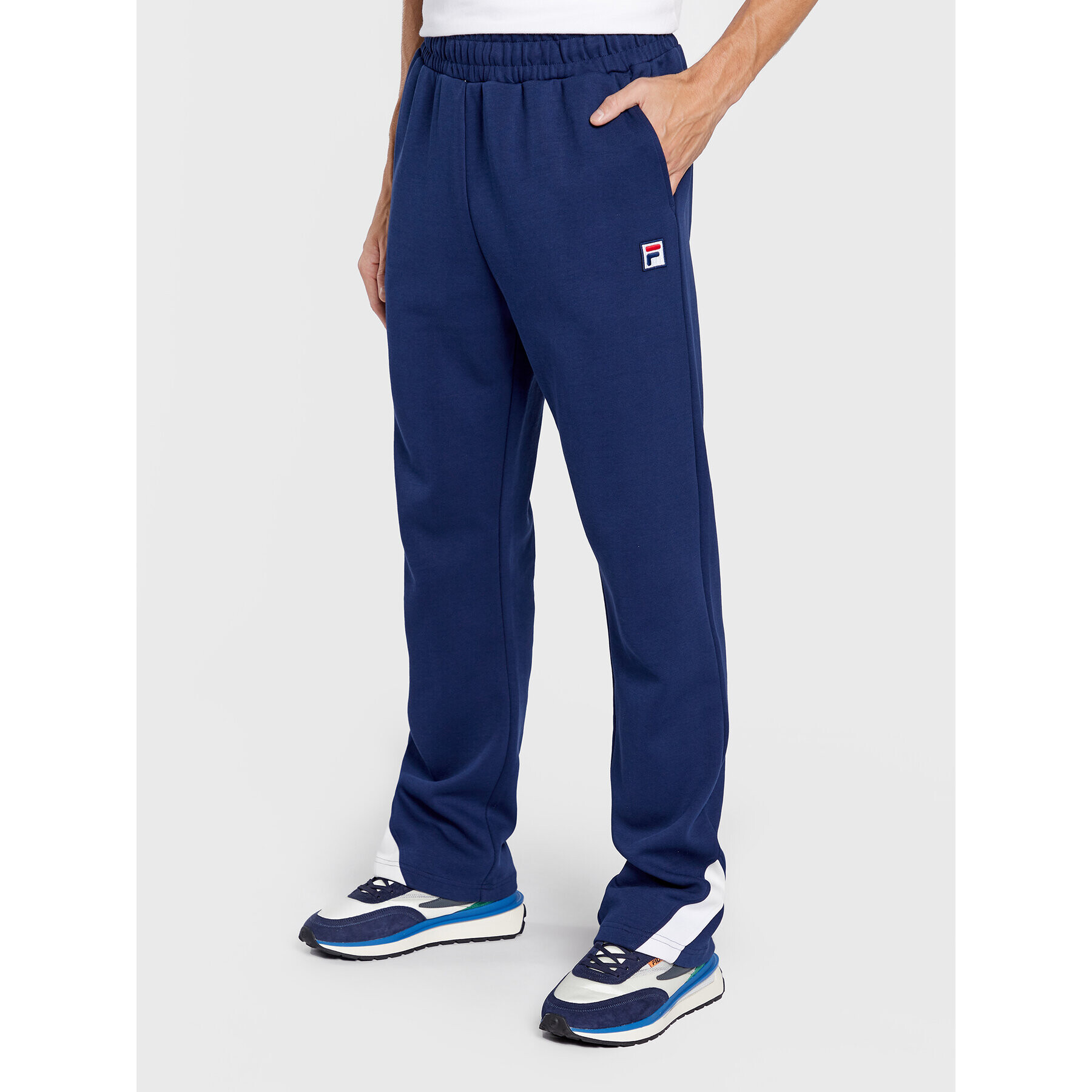 Fila Spodnji del trenirke Zigong FAM0169 Mornarsko modra Regular Fit - Pepit.si