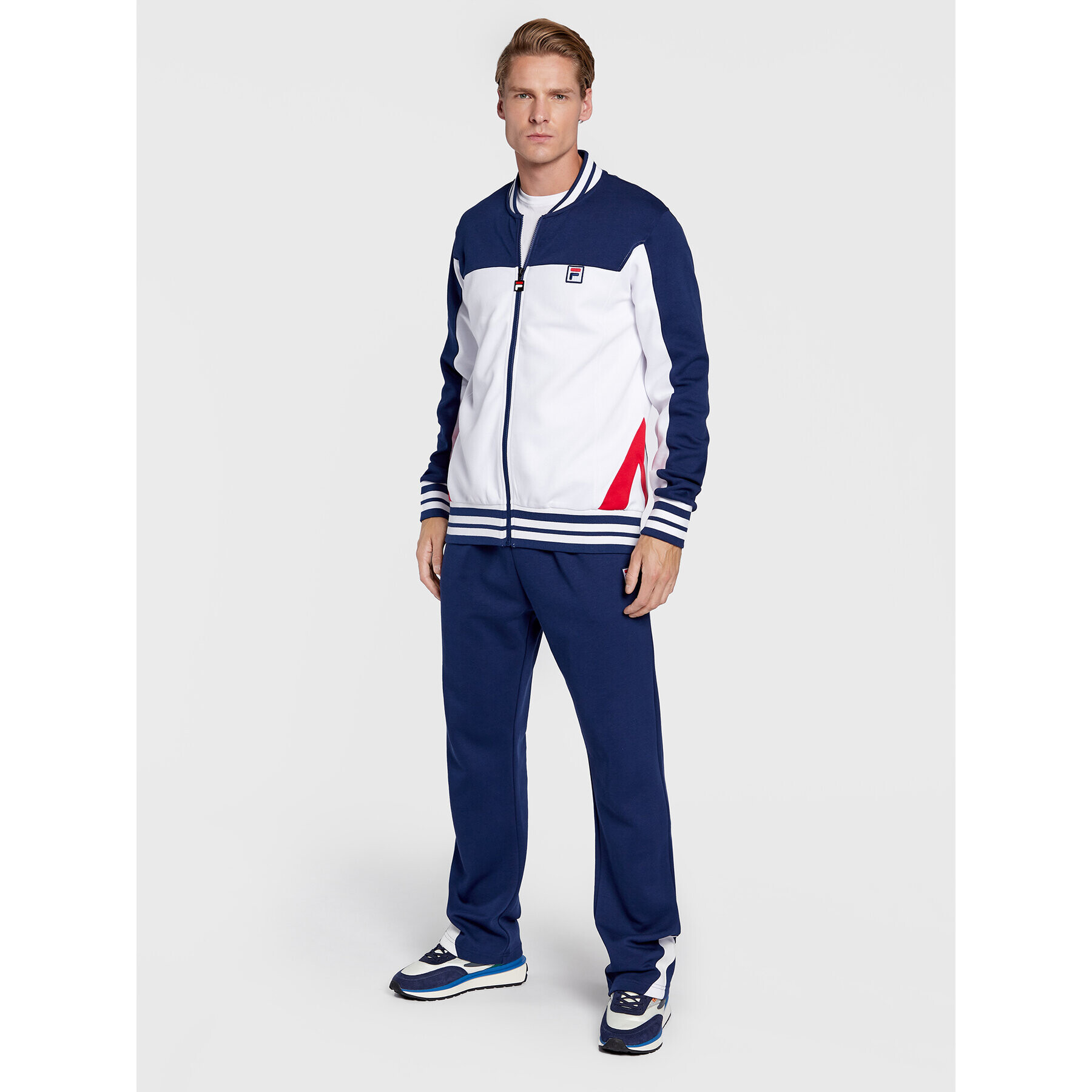 Fila Spodnji del trenirke Zigong FAM0169 Mornarsko modra Regular Fit - Pepit.si