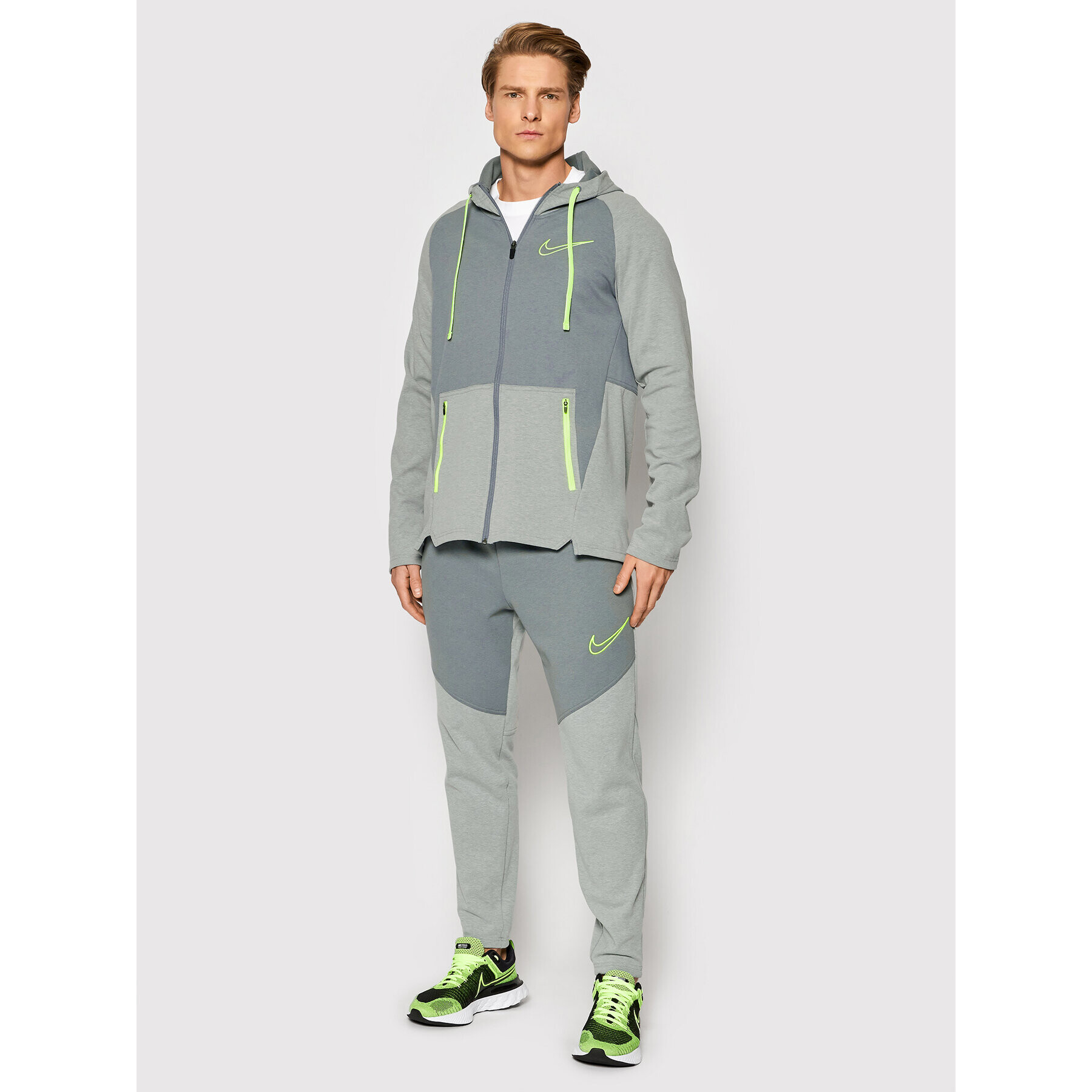 Nike Spodnji del trenirke Therma-Fit DD2108 Siva Regular Fit - Pepit.si