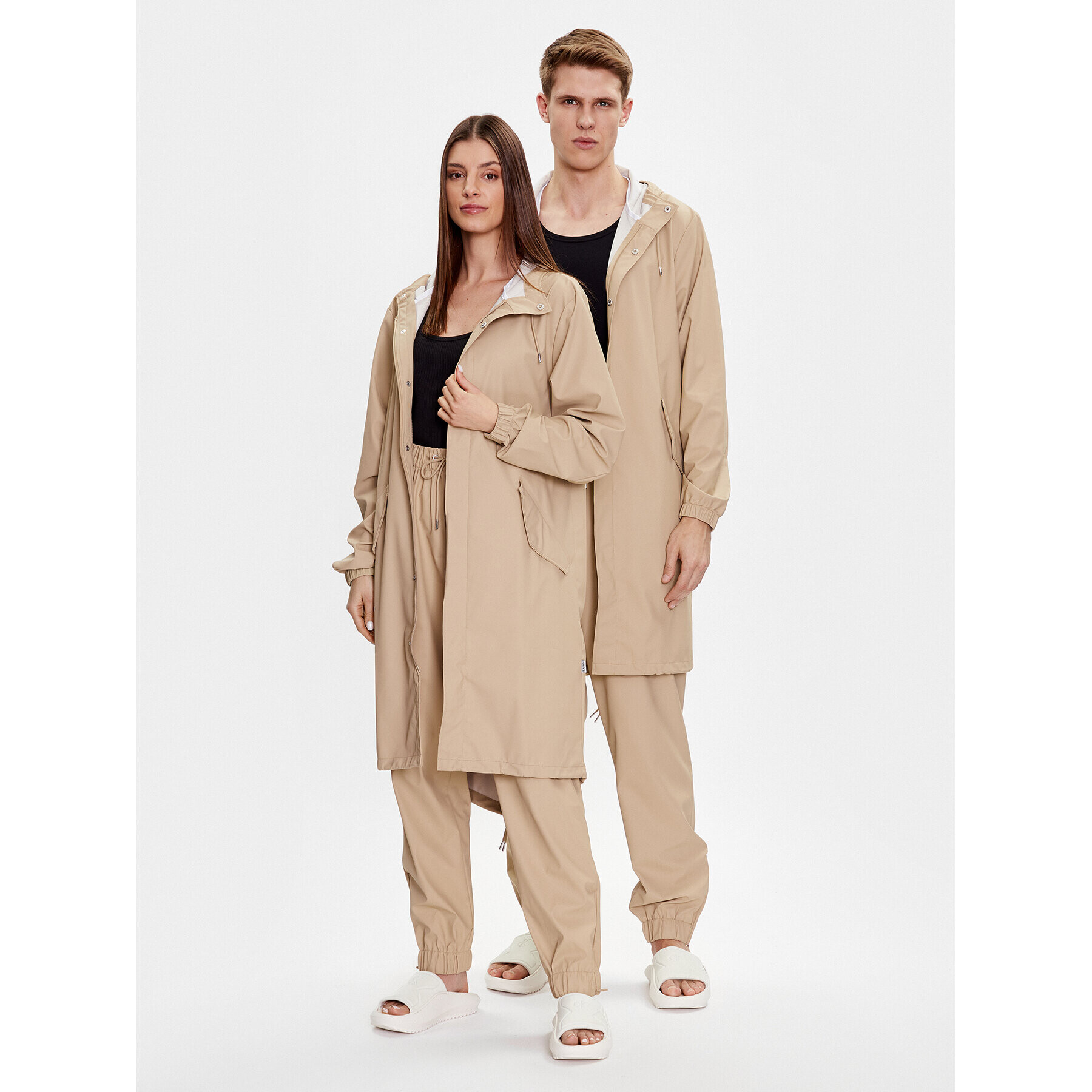 Rains Hlače iz tkanine Unisex 18560 Bež Comfortable Fit - Pepit.si