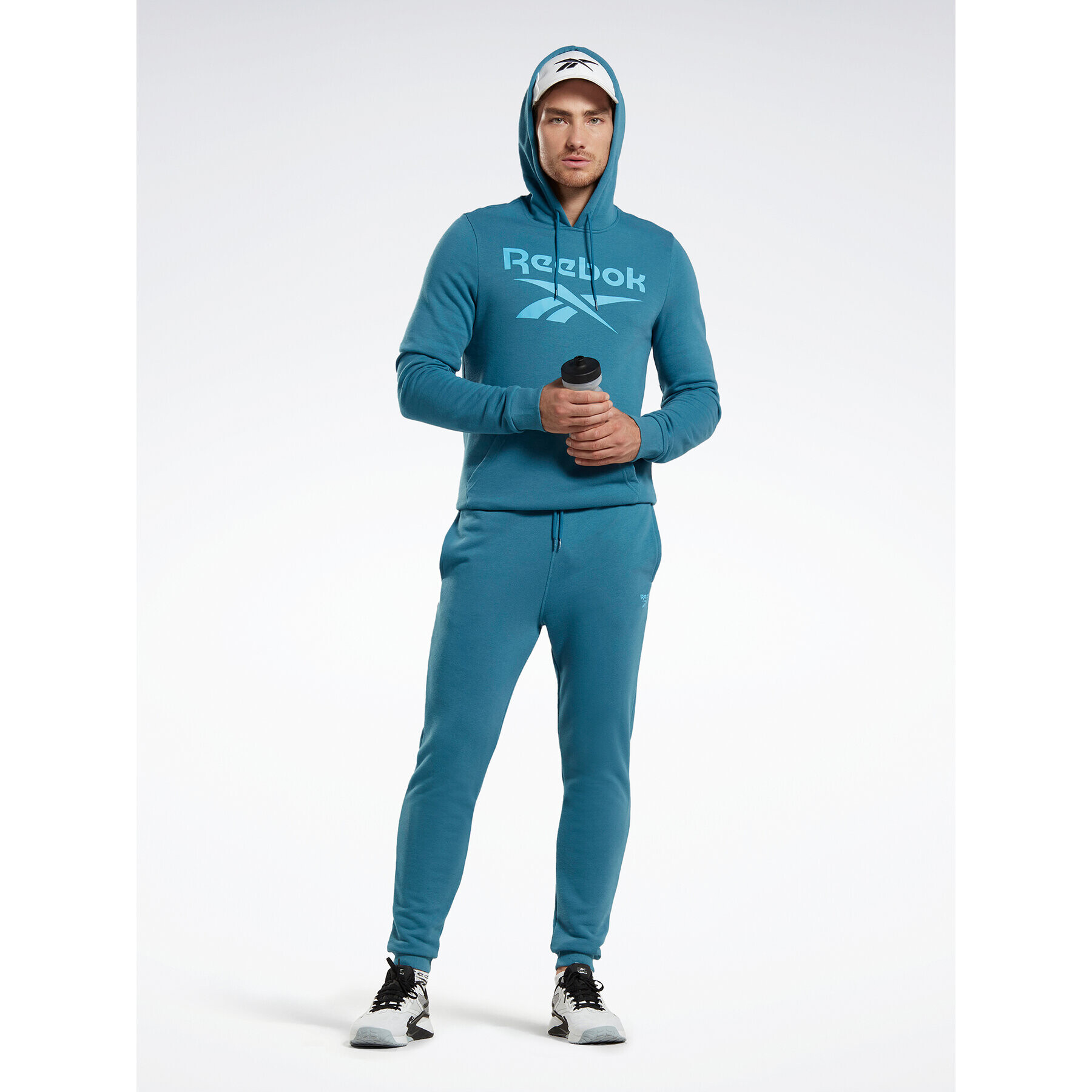 Reebok Spodnji del trenirke Identity French Terry Joggers H49680 Modra Regular Fit - Pepit.si