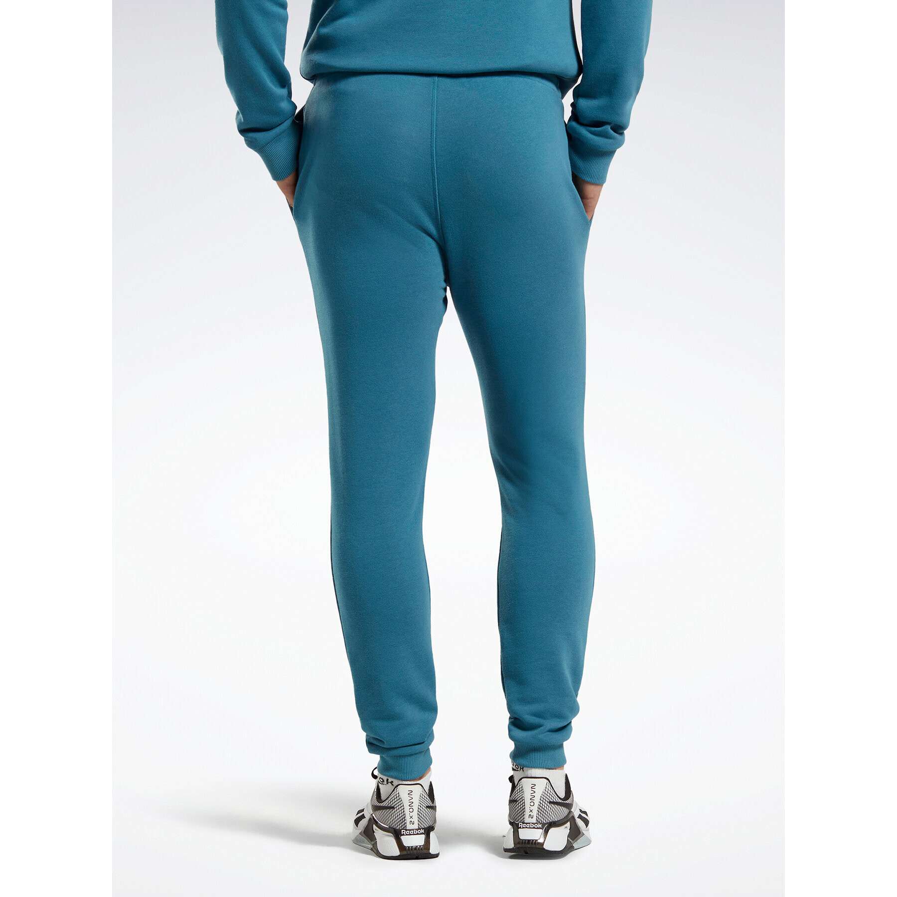 Reebok Spodnji del trenirke Identity French Terry Joggers H49680 Modra Regular Fit - Pepit.si