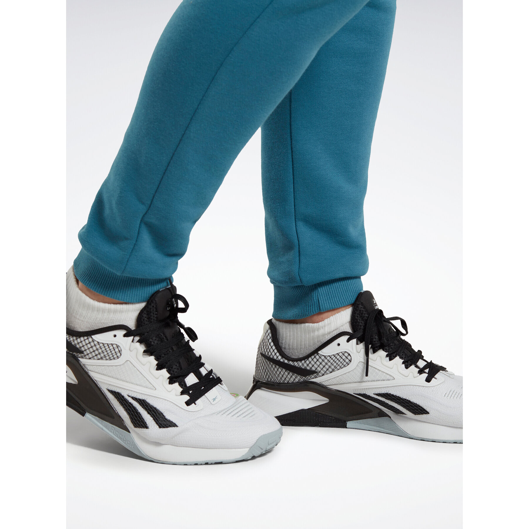 Reebok Spodnji del trenirke Identity French Terry Joggers H49680 Modra Regular Fit - Pepit.si