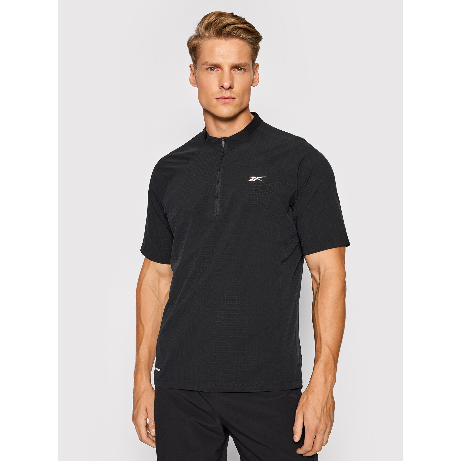 Reebok Športna majica Les Mills H08977 Črna Slim Fit - Pepit.si