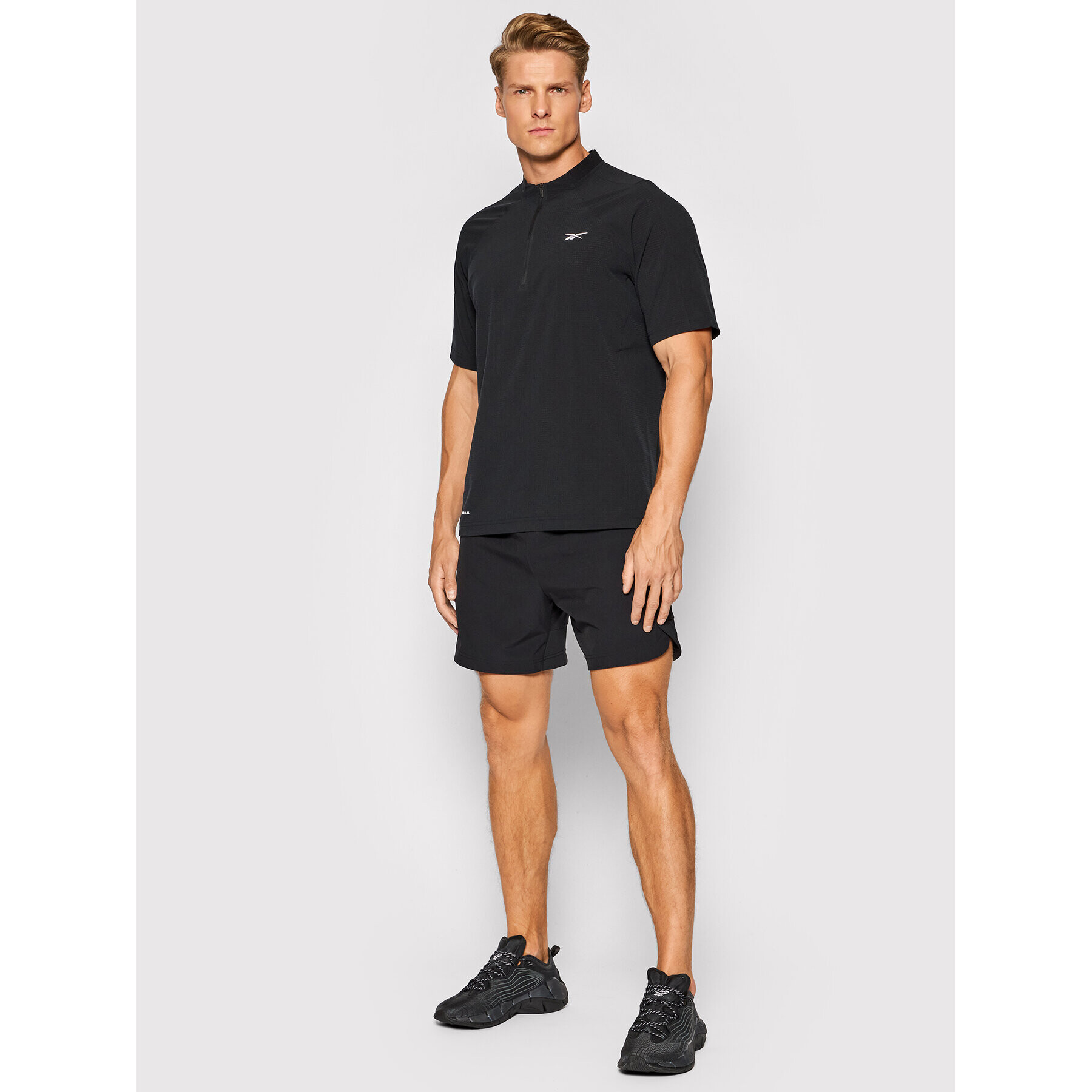 Reebok Športna majica Les Mills H08977 Črna Slim Fit - Pepit.si