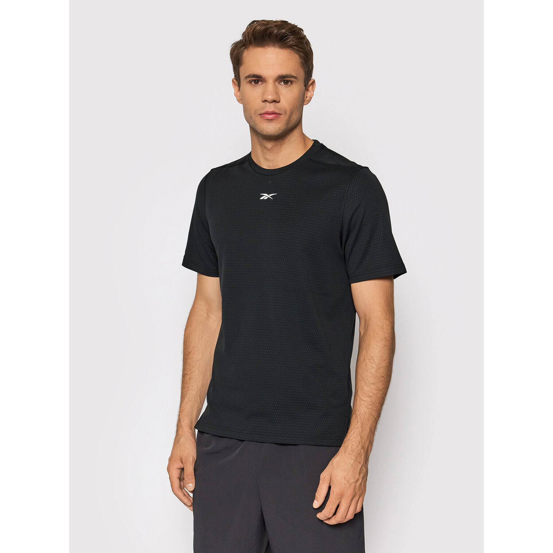 Reebok Športna majica Sweatshift Move GN9099 Črna Slim Fit - Pepit.si