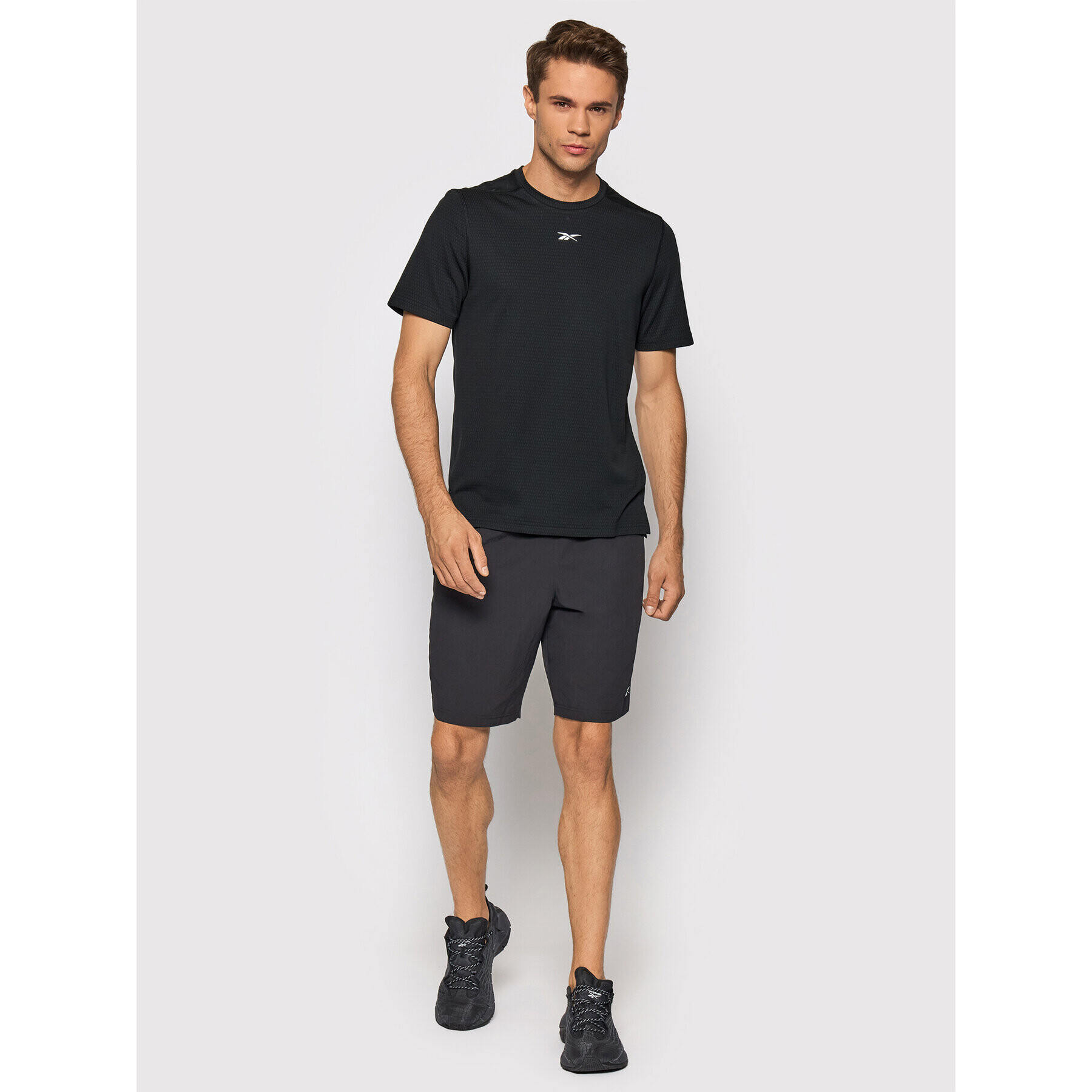 Reebok Športna majica Sweatshift Move GN9099 Črna Slim Fit - Pepit.si