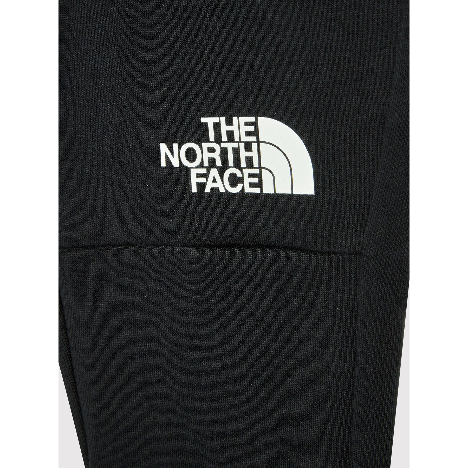 The North Face Spodnji del trenirke Slacker NF0A55LM Črna Regular Fit - Pepit.si