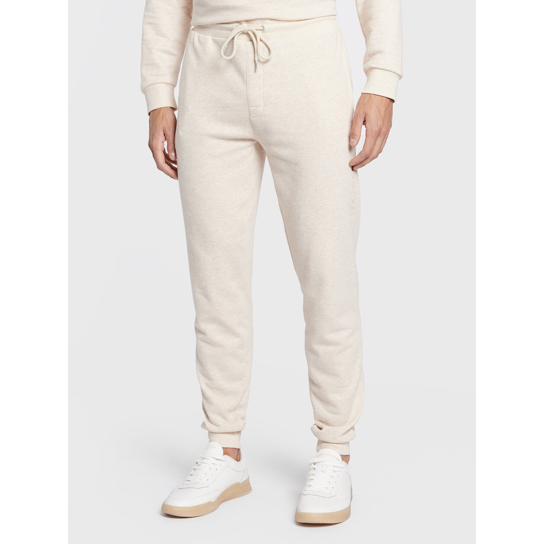 Tommy Hilfiger Spodnji del trenirke UM0UM02667 Bež Relaxed Fit - Pepit.si