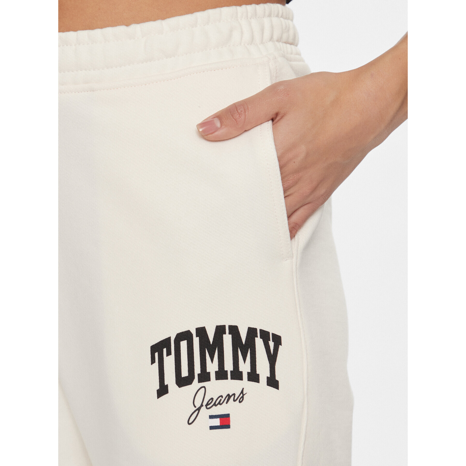 Tommy Jeans Spodnji del trenirke New Varisty DW0DW16379 Bela Relaxed Fit - Pepit.si