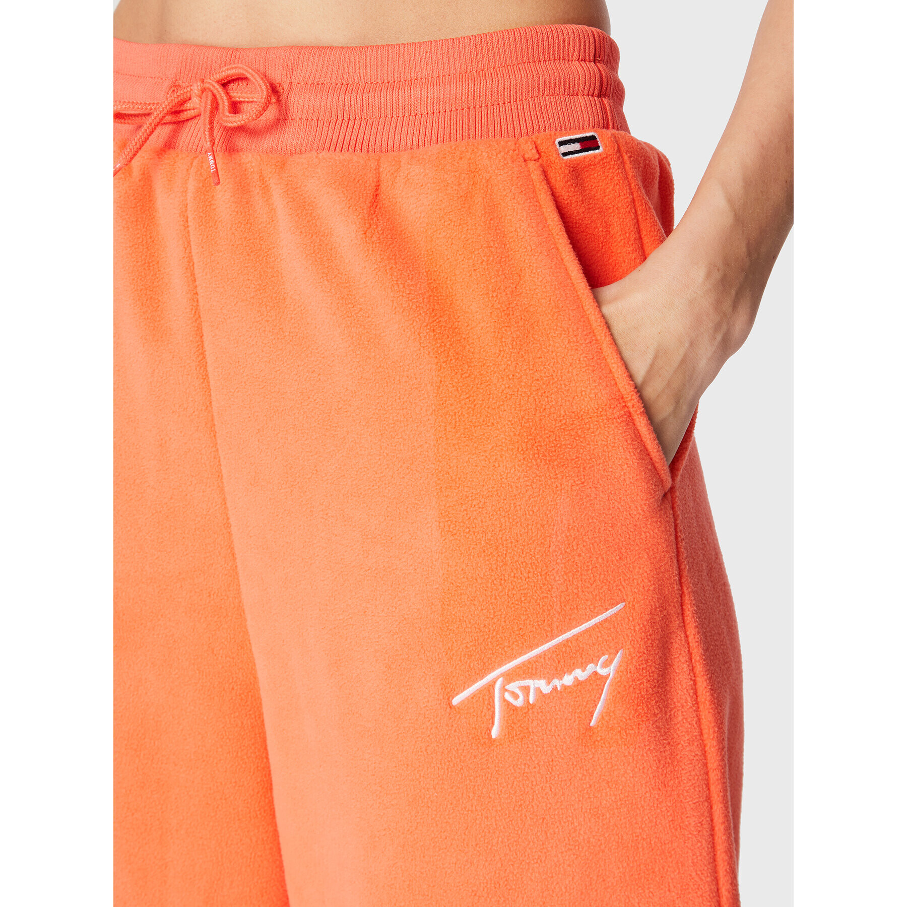 Tommy Jeans Spodnji del trenirke Signature Fleece DW0DW14435 Oranžna Relaxed Fit - Pepit.si