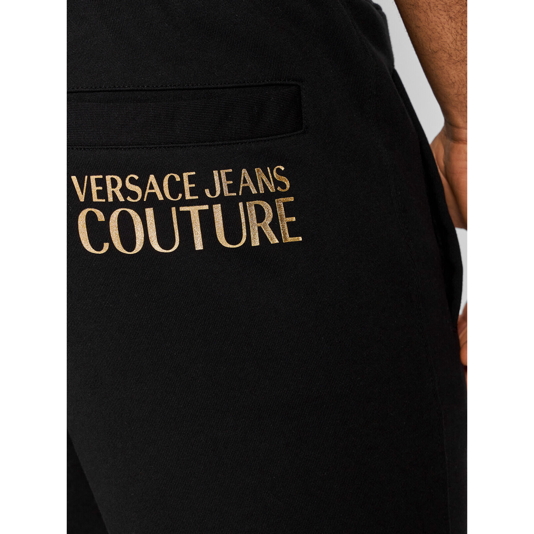 Versace Jeans Couture Spodnji del trenirke Logo Thick Foil 72GAAT01 Črna Regular Fit - Pepit.si